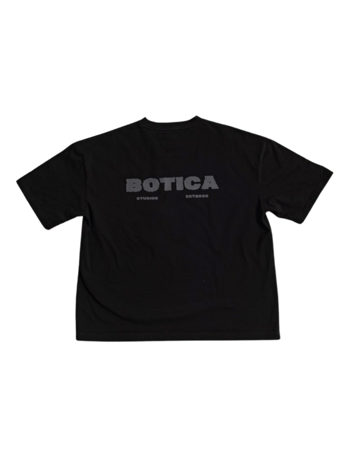 Back of The Back Hit Tee in black laid flat, with the grey BOTICA STUDIOS print across the upper back
