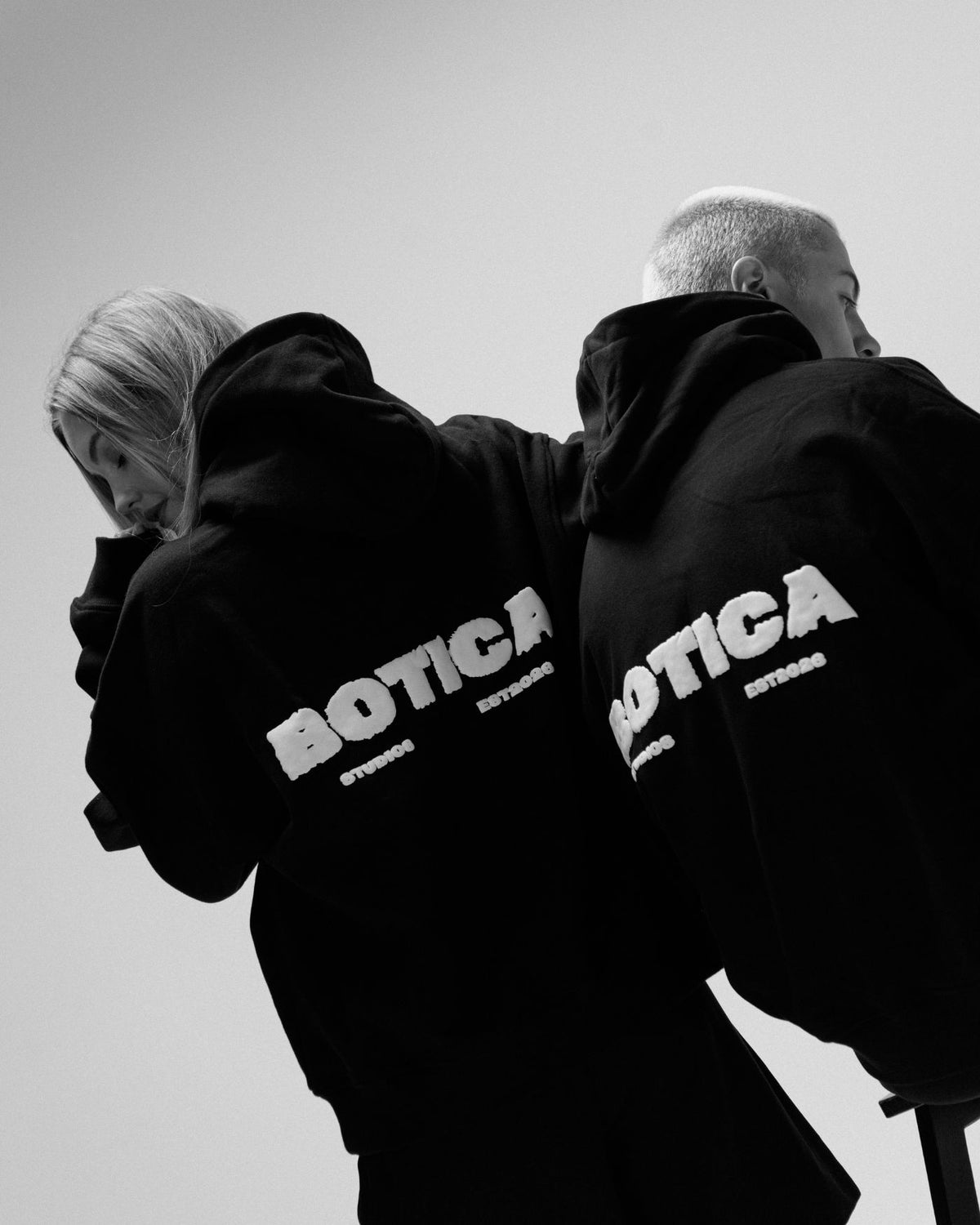 Botica Studio Legacy Hoodie worn by two models in a campaign image