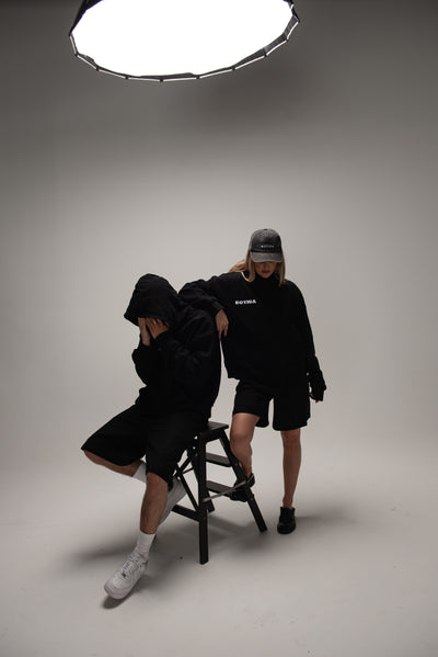 Botica Studio Legacy Hoodie worn by two models in a fashion campaign video